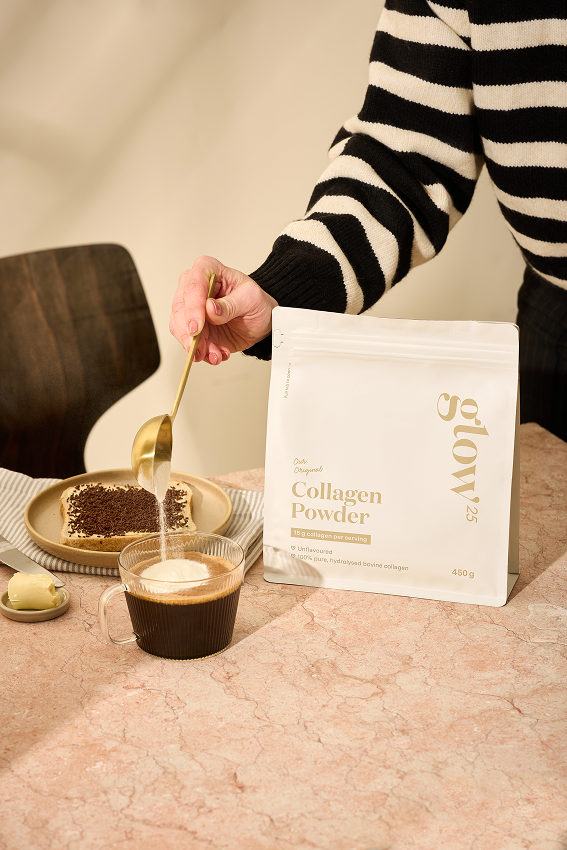 Woman putting collagen in her breakfast coffee